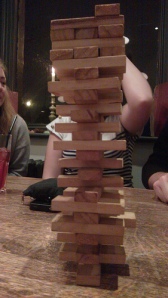 Game of Jenga with mostly just middle blocks left.